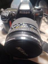 Nikon N 80 with 50mm f/1.8 nikkor lens, UV filter and carry bag