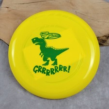 Wham-O Brand Frisbee T-Rex Yellow Green Dinosaur Grrrrrr New With Sticker