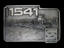 UD09135 NOS VINTAGE 1983  SUNFLOWER MODEL 1541  FARM EQUIPMENT BELT BUCKLE