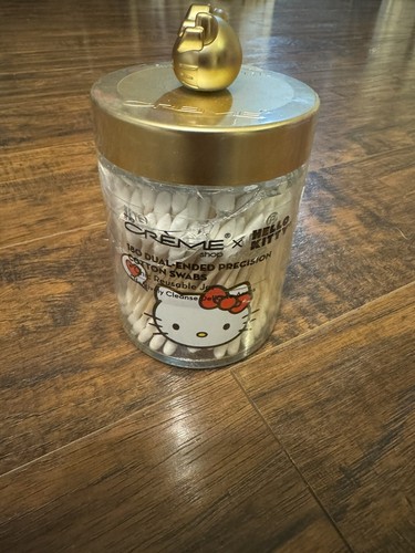 The Crème Shop Hello Kitty Reusable Glass Jar with Cotton Swabs Matte Gold