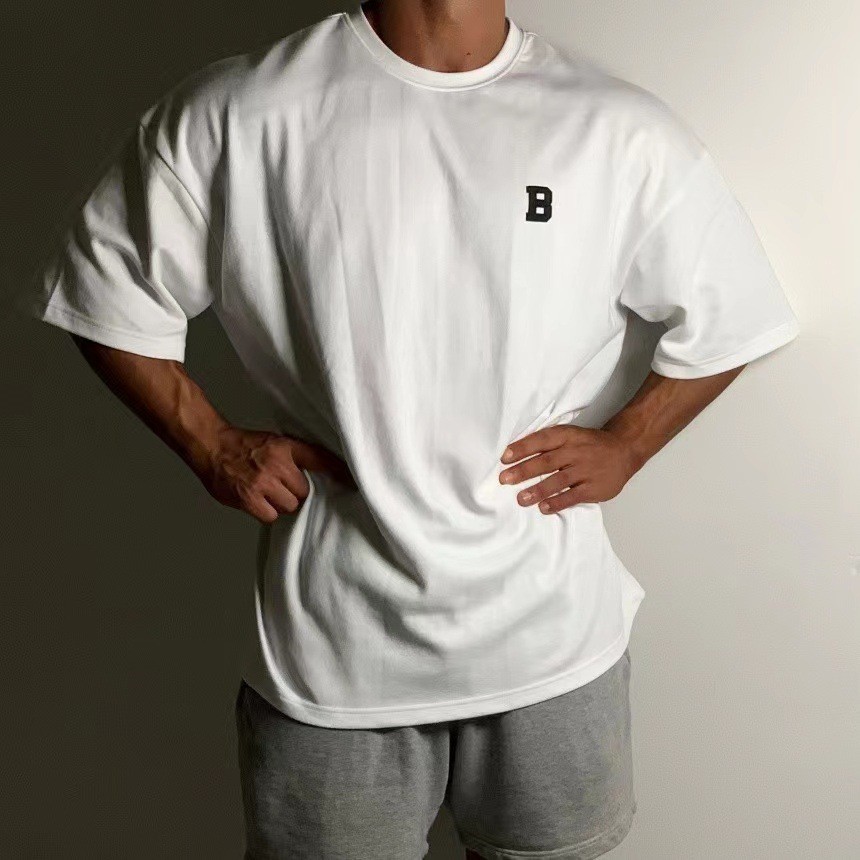 Camiseta para hombre de gran tamaño con hombros caídos musculosos calce suelto gimnasio fitness ropa de calle