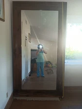 Huge wooden mirror 4.5 by 6.5 feet beveled immaculate glass.