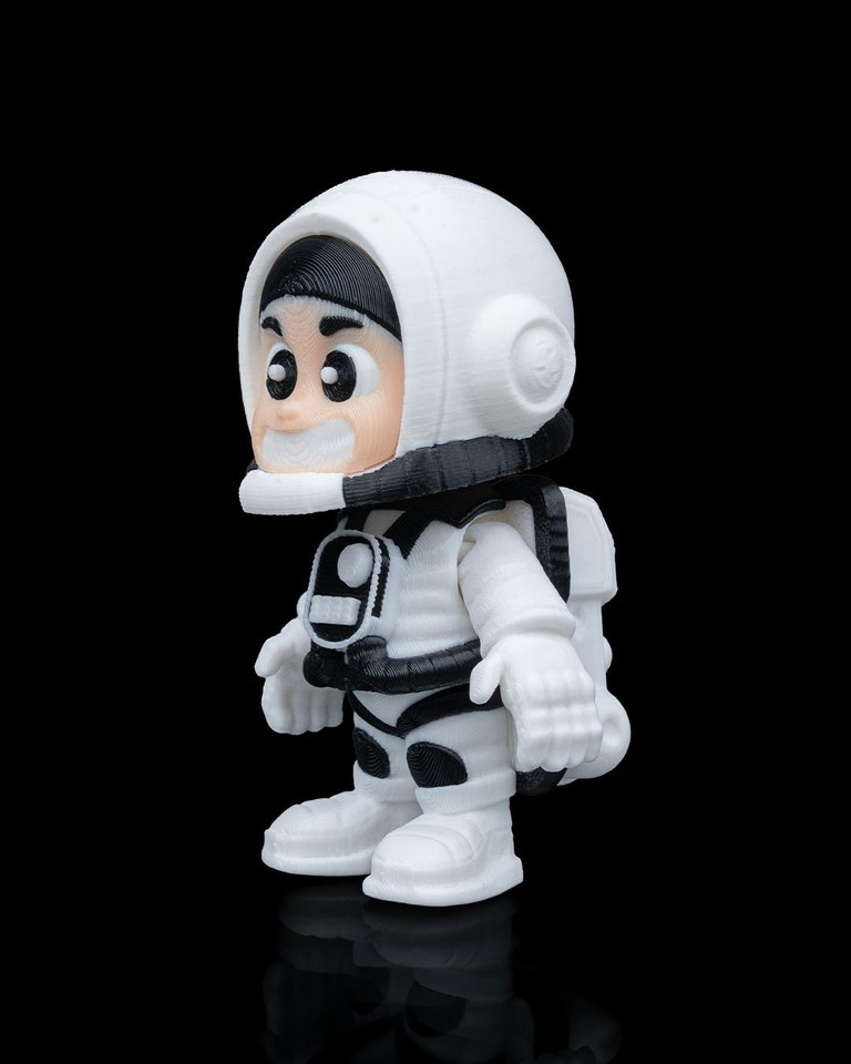 A chunky retro astronaut figurine with old-school space-age charm — the kind of desk companion that sparks a conversation about the golden age of space exploration.