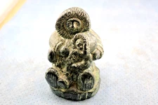 A WOLF SCULPTURE ESKOMO FIGURE OF INUIT MOTHER HOLDING CHILD CANADA WOLF STUDIOS