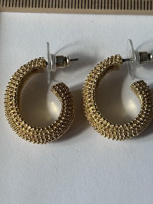 Vintage gold-tone hoop earrings featuring a beaded, popcorn-style texture