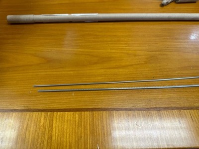 2 pieces of small gauge fret wire