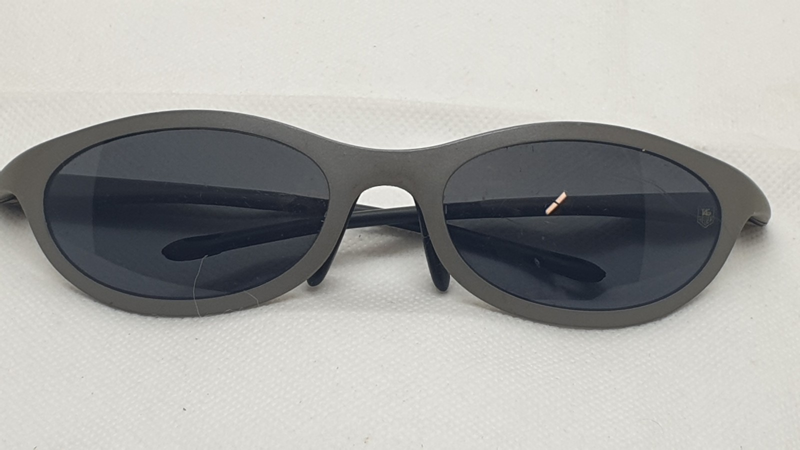 Tag Made Heuer Oval France. in Gray Shaped Frame Sunglasses Model 1002. - VintageWatches.PK Tag Made Heuer Oval France. in Gray Shaped Frame Sunglasses Model 1002. - vintagewatches.pk