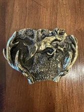 VINTAGE 1982 JUMPING DEER THROUGH ANTLERS - The Great American belt buckle Co. 