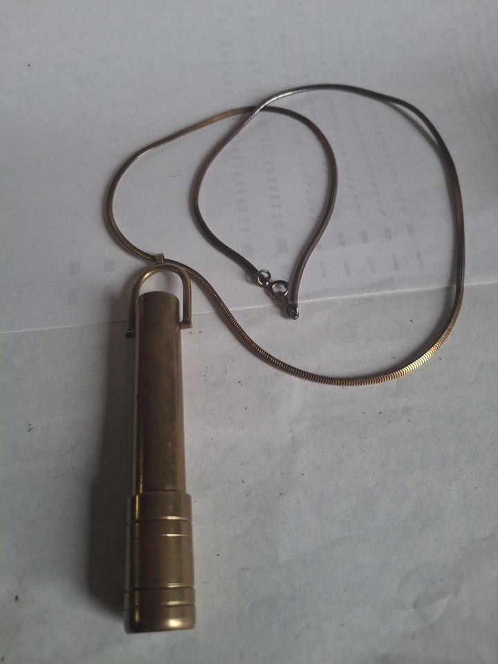 A signed 1981 C. Bennett Scopes wearable kaleidoscope pendant — a functioning optical instrument you can actually wear around your neck.