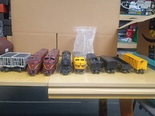 Lot of Lionel Train Cars with Train Display/Village Accessories