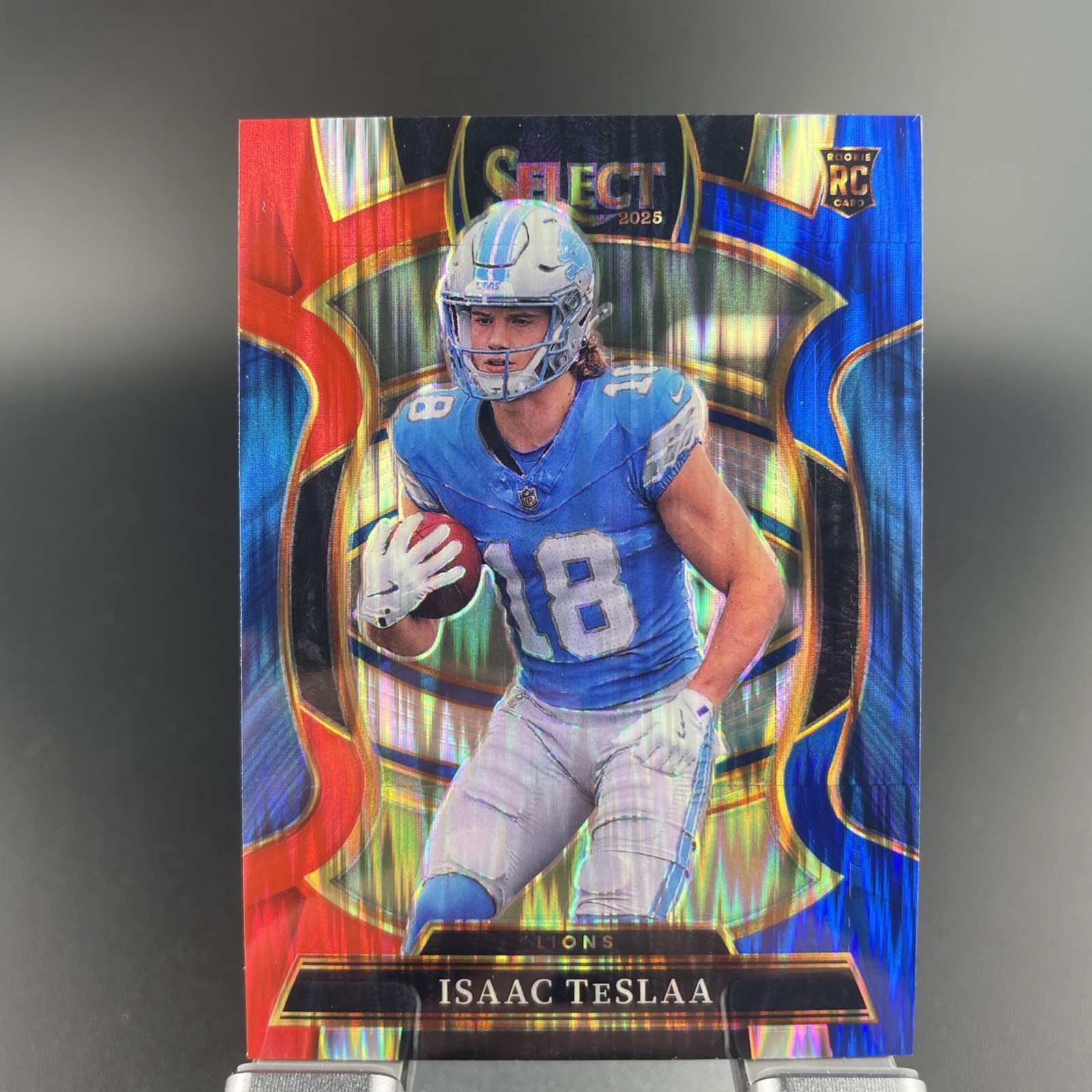 2025 Panini Select - Concourse Level Isaac Teslaa RC Red & Blue Shock Prizm