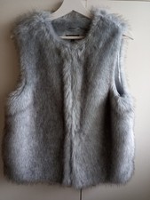 Top Shop faux fur gilet. Mid to light grey black flecks. Satin style lining