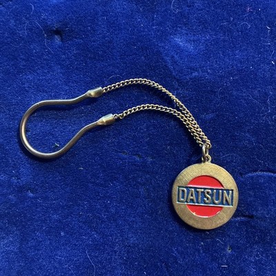 Datsun Vintage Gold Toned Original key fob race chain ring car speed