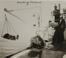 WW2 Loading Patient on ship injured U.S. Soldier at sea original vintage photo
