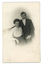 RPPC Older Couple Wicker Chair Fashion Studio Portrait Real Photo Postcard