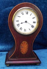 An Inlaid Rosewood Balloon Mantel Clock