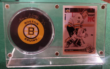 Autographed Boston Bruins  Hockey Puck Andy Moog #35 and card in acrylic case