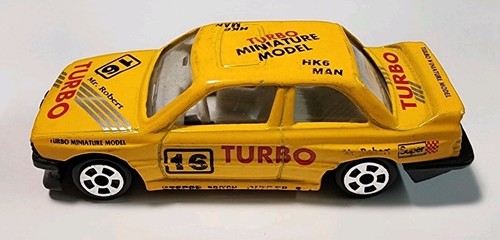 Auto da corsa BMW E30 M3 Turbo gialla senza marchio 1991 1/64 pressofusa/plastica HTF - Foto 4 di 10