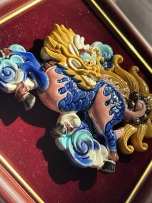 Chinese Qilin (mythical creature) featuring a blue, yellow, pink glazed picture
