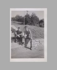 WW2 Photo U.S. Army GIs One No Shirt Sitting On Stone Steps Trees In Back