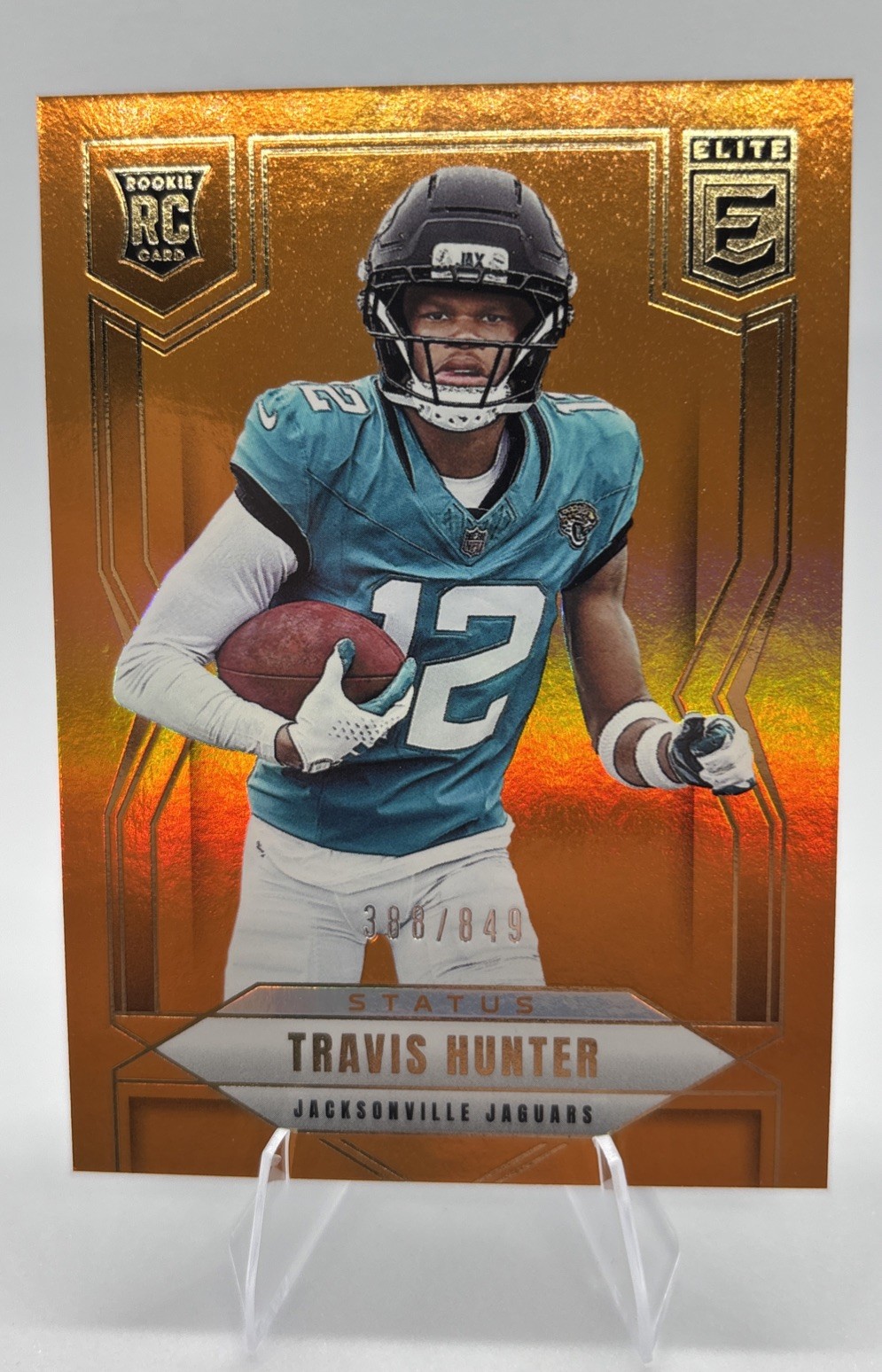 Travis Hunter Status Metallic Orange Rookie 2025 Panini Elite #114 813/849