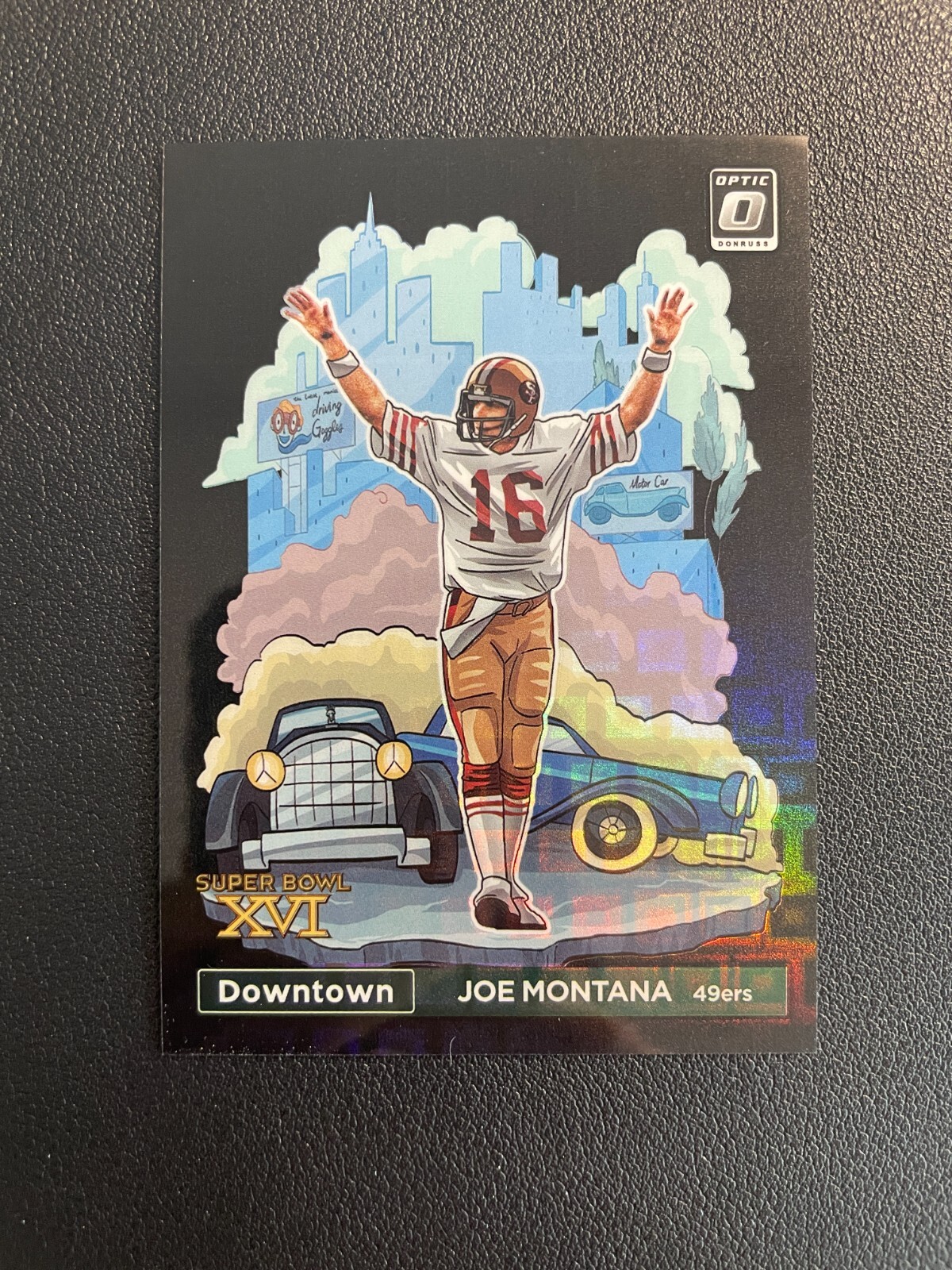 2023 Donruss Optic Joe Montana Downtown Black Pandora Prizm 16/25 BJGK