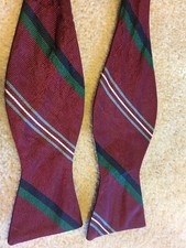 Men's trad bowtie in maroon with alternating stripes; original owner