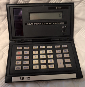RARE Vintage Kyocera SR-12 Foldable Solar-powered electronic calculator WORKS!