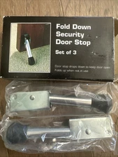 Set Of 2 Fold Down Security Door Stops New In Box