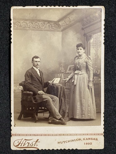 Hutchinson Kansas KS Man Woman Looking At Picture Reno Co. Antique Cabinet Photo