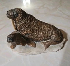 Walrus charmstone statue sculpted by the famed naturalist Earl Sherwan. 