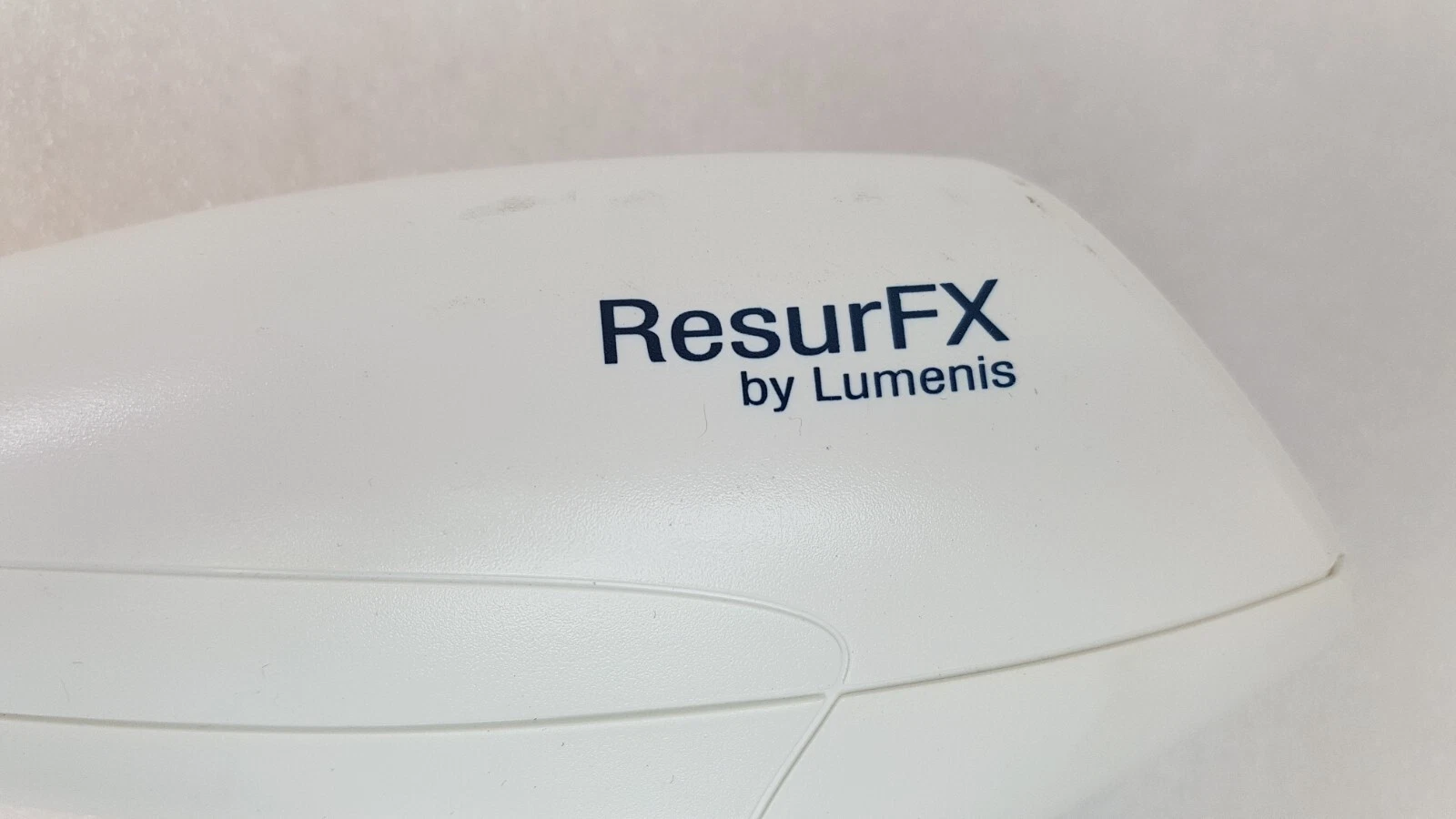 ResurFX by Lumenis logo on the handpiece housing