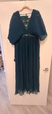 Teal pleated gown with jeweled bodice and flutter sleeves.