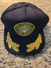 Vintage mesh trucker-style snapback hat featuring a "United States Army Retired"