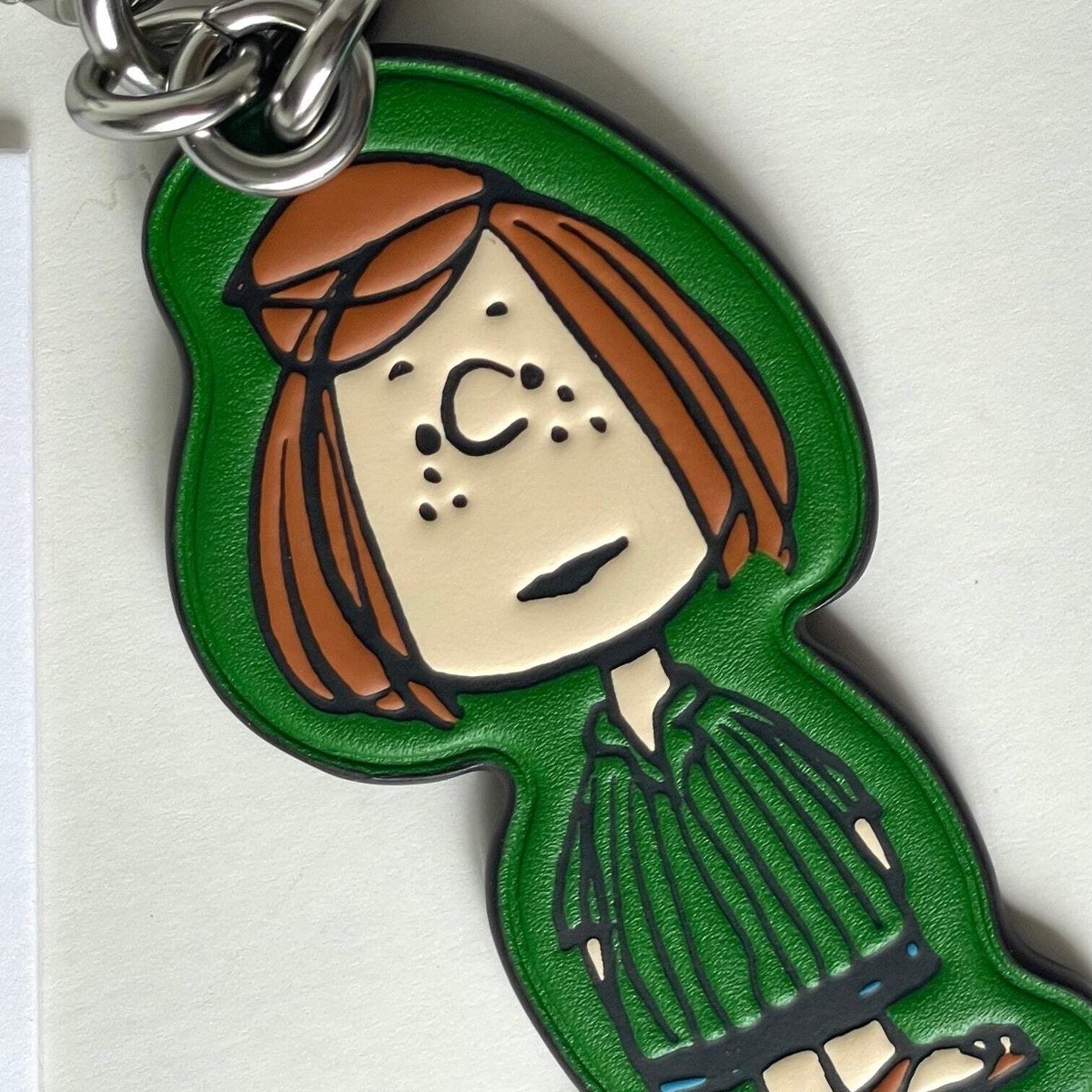 COACH✖️PEANUTS キーホルダー Coach x Peanuts 2025 Lucy Leather Bag Charm Keychain CBG58
