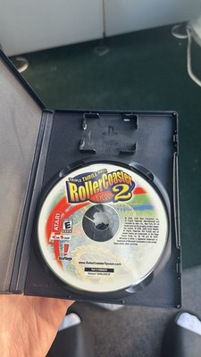 ZooEmpire and Rollercoaster Tycoon 2 PC game disc