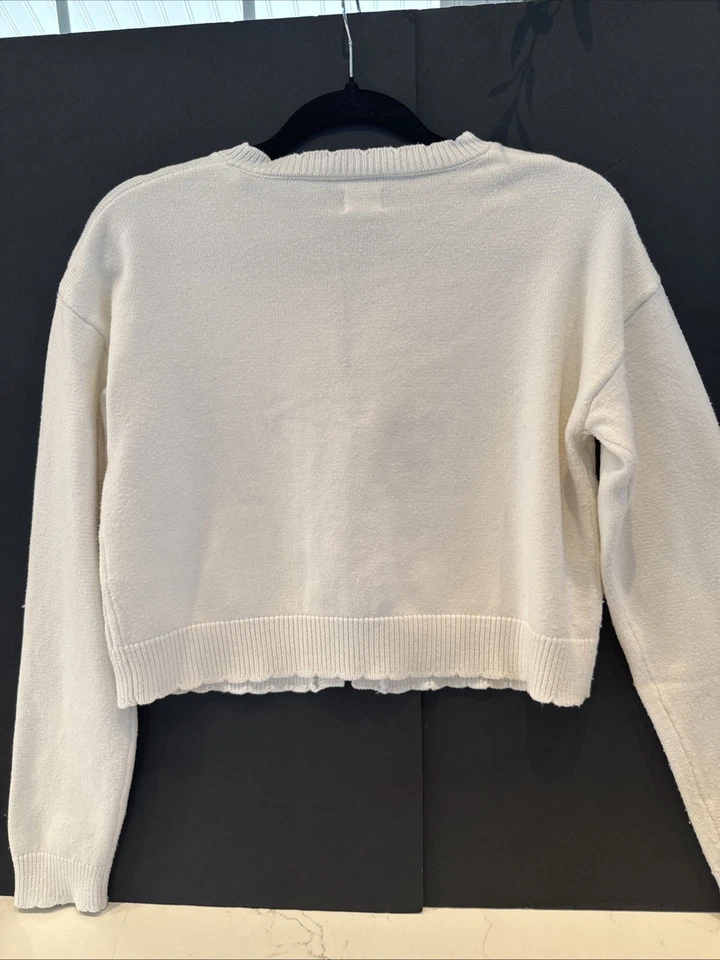 Suéter de algodón marfil con detalles de lazo. Talla M. Foto 4 de 4