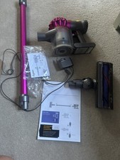 Switches on Dyson V7 Motorhead Cordless Handheld Vacuum Cleaner Pink edition 