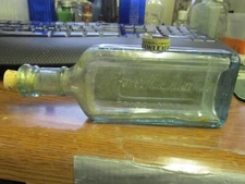 Rawleigh's Freeport, ILL. Extract of Lemon bottle w/ matching folding corkscrew 