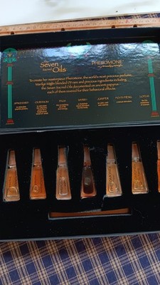 Marilyn Miglin The Seven Sacred Oils Of Pheromone ,open box, 7 viles are full.