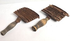 TWO ANTIQUE CURRY COMBS - STEEL with WOOD HANDLES