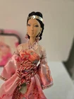 Barbie doll vintage with black hair and silk dress