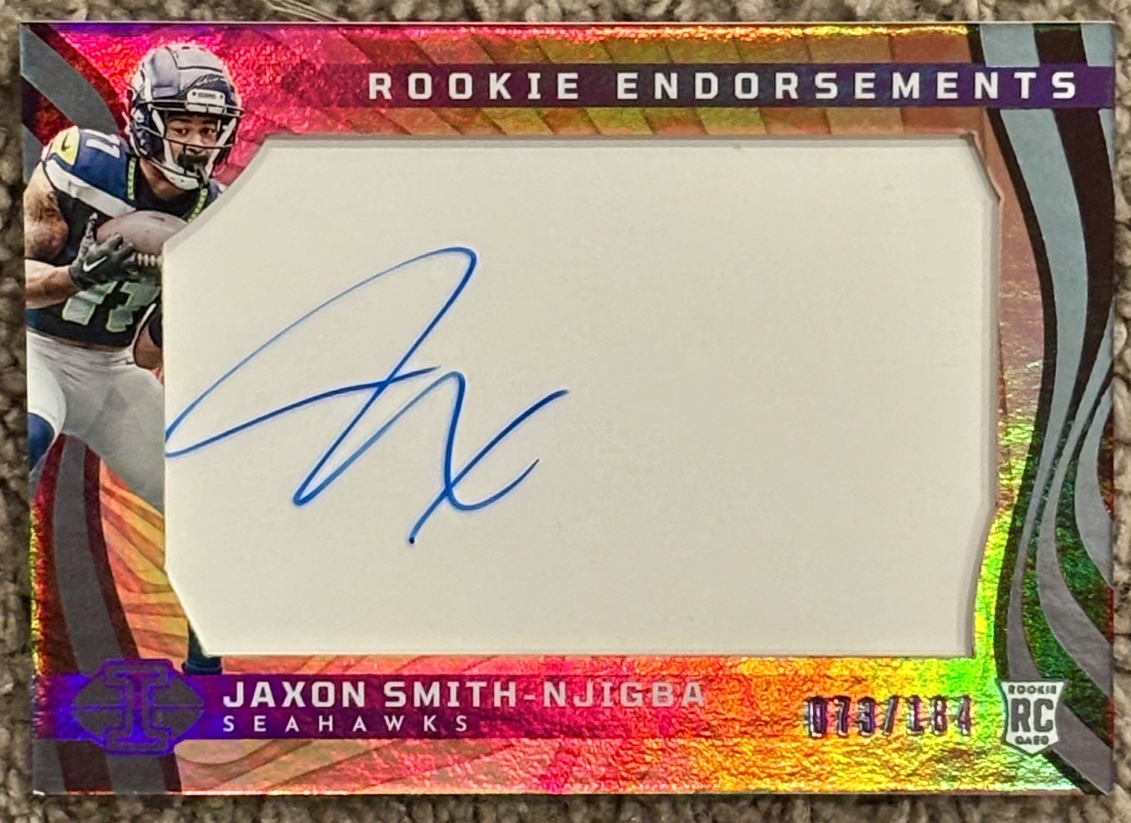 Jaxon Smith-Njigba #RE-JSN Football Cards 2023 Panini Illusions Rookie Endorsement trading card — raw and PSA graded price guide
