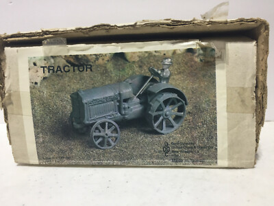 McCormick-Deering Cast Iron Tractor w Silver Driver 1/16 by United China & Glass