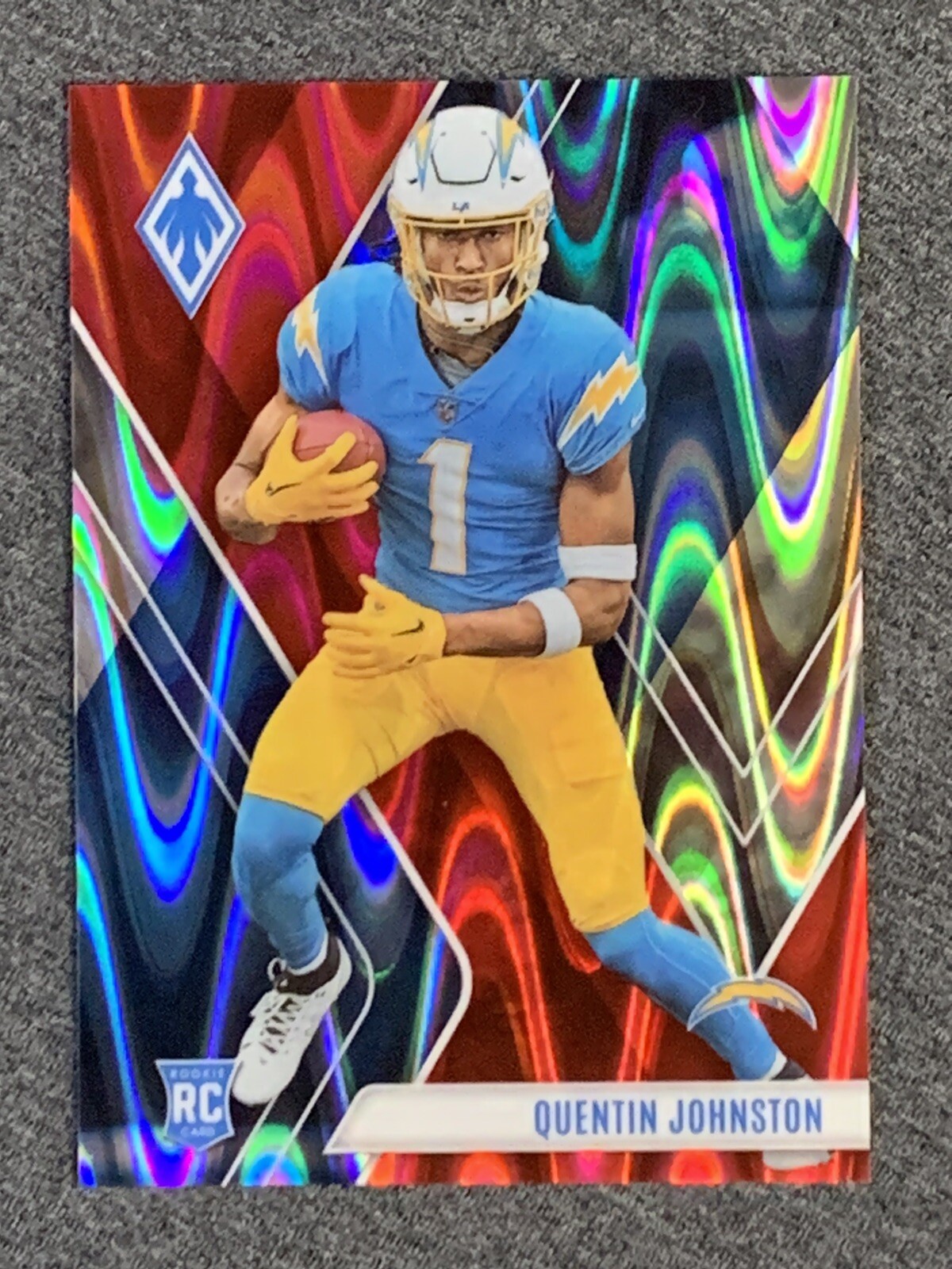 2023 Panini Phoenix Rookies Quentin Johnston Red Seismic /199 #107 Rookie RC