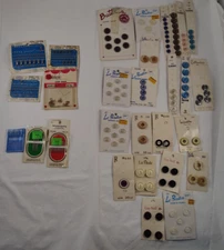 LOT OF 30 ASSORTED PACKS OF BUTTONS SEWING NEEDLES HOOKS EYES AND LOOPS