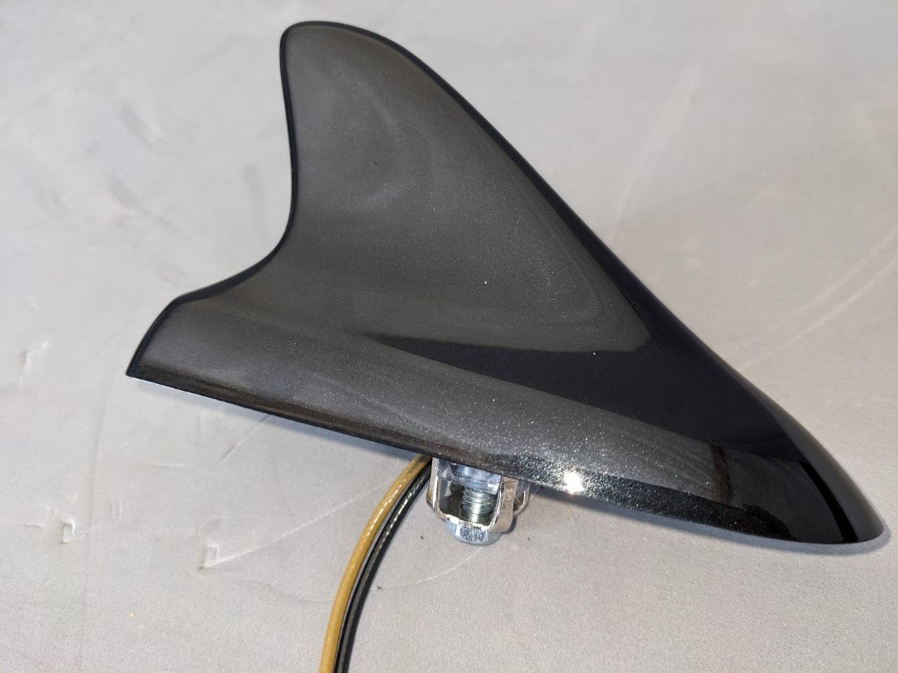 Upgrade your vehicle with the GM Shark Fin GPS and Radio Base Antenna designed for ATS Camaro LaCrosse Regal in sleek Carbon Flash finish