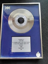 ELTON JOHN SILVER DISC AWARD - BLUE EYES 1982 PRESENTED TO HIS MANAGER JOHN REID