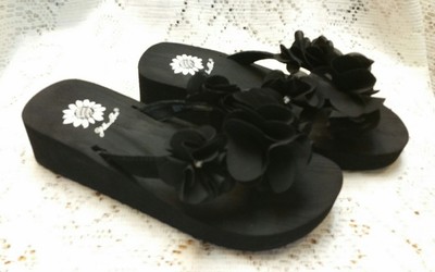 black fabric flip flops