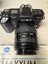 Minolta MAXXUM 7000 AF Camera W/ 2 Sigma Lenses, Flash, Manuals. Tested See Pic